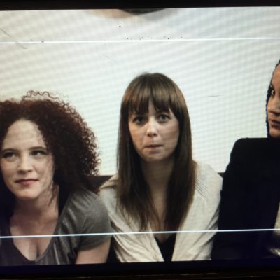 Sarah Schoofs, Lauren A. Kennedy,  and Rory Lipede on the monitor between takes. SOMEONE is trying to stifle a laugh.